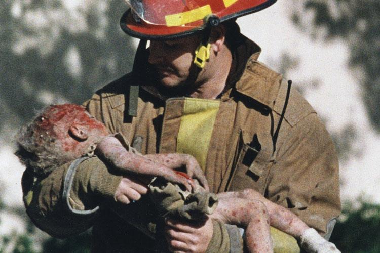 oklahoma city firefighter chris fields holding baby angel baylee almon